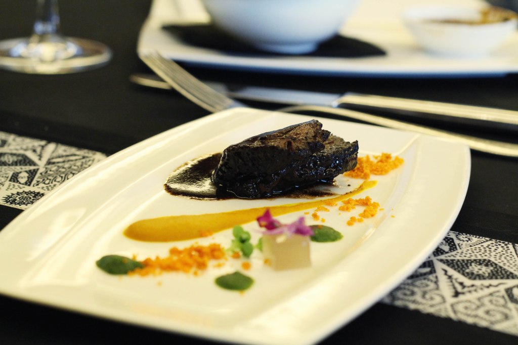 Veal cheek with deconstructed rawon sauce by Petty Elliott